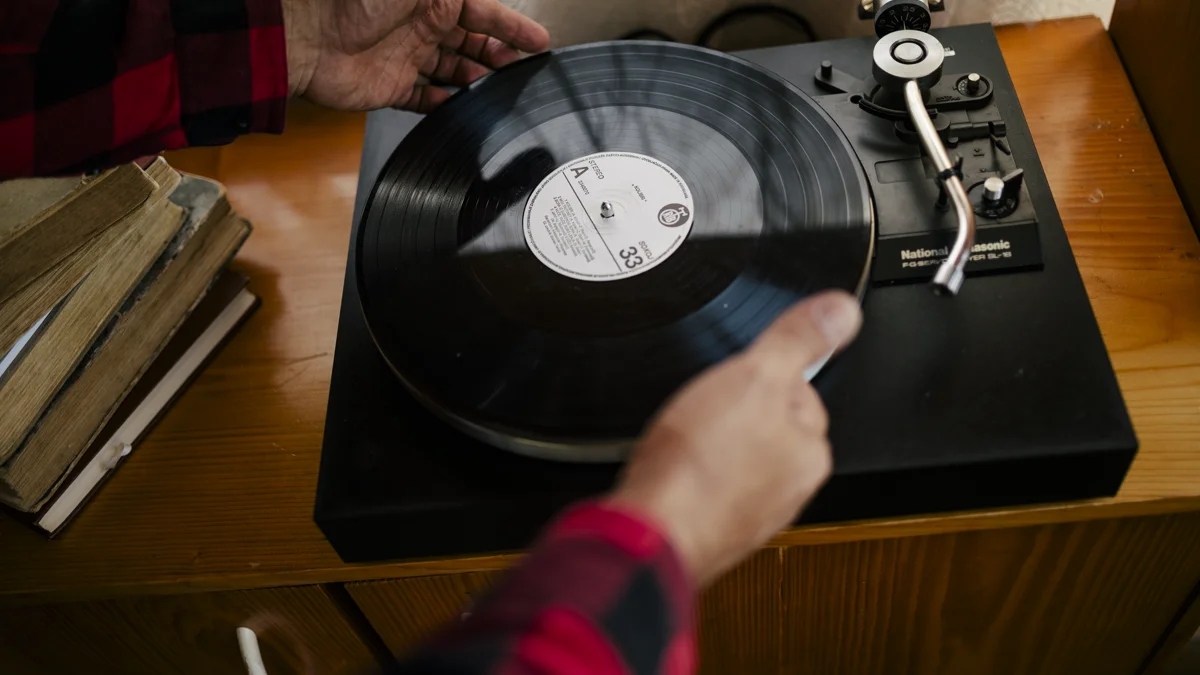 Classic records beside a turntable in a warm room Classic music records arranged beside a turntable setting a relaxed atmosphere for trivia night