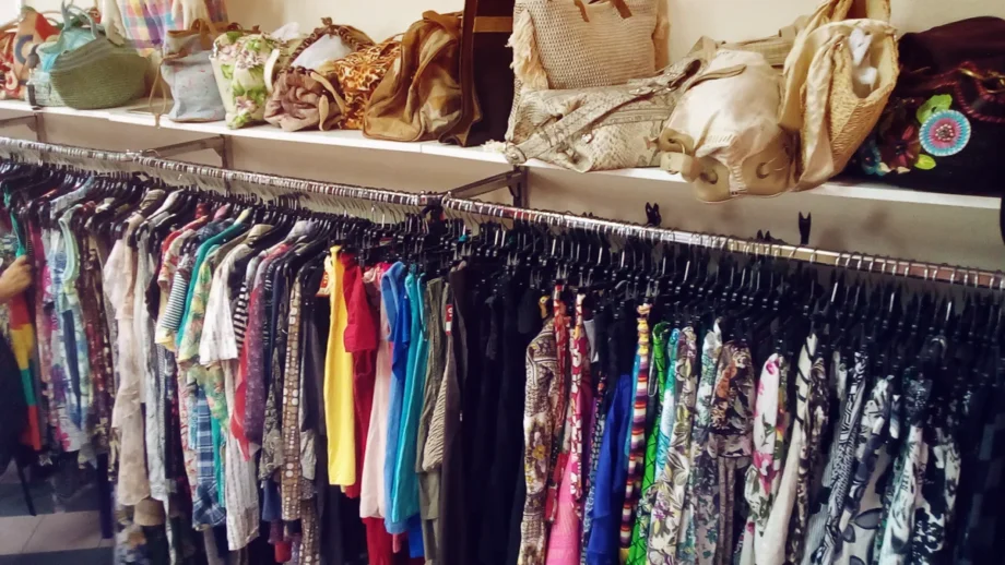 Clothing racks in a vintage thrift shop for sourcing creative pop star costume ideas