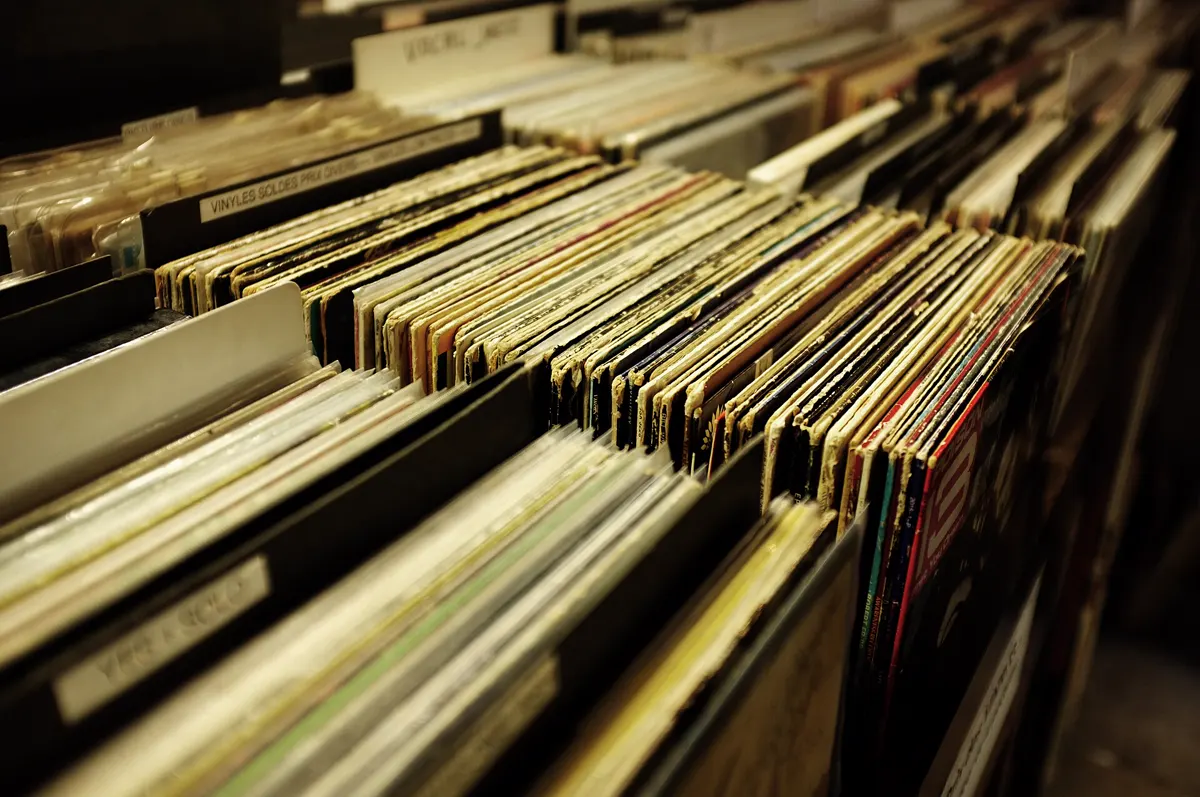 Rows of second-hand vinyl records in crates at a record shop in Lyon
