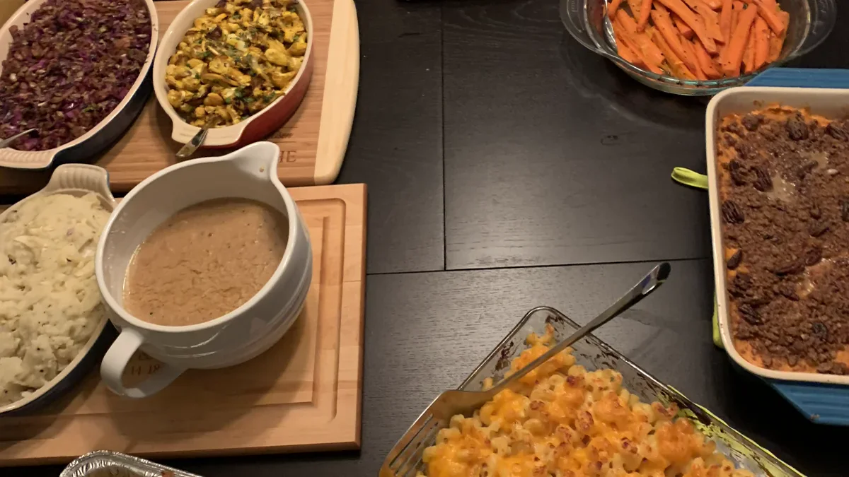 Thanksgiving holiday feast table with casseroles side dishes and festive home comfort
