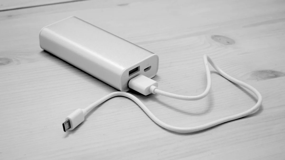 Compact portable power bank battery charger for keeping smartphones powered during concert tours